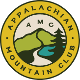 Circular logo shows mountain and pine tree with trail, surrounded by yellow border with organization name