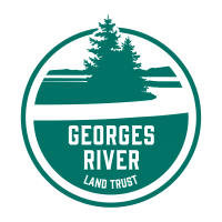 green circle surrounds a silhouette river and forested river bank, with organization's name below